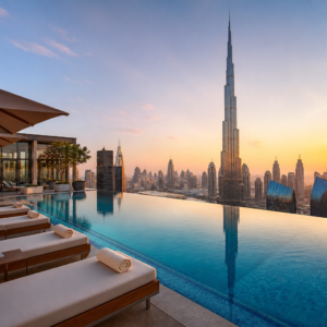 Luxury rooftop infinity pool overlooking Burj Khalifa at sunset